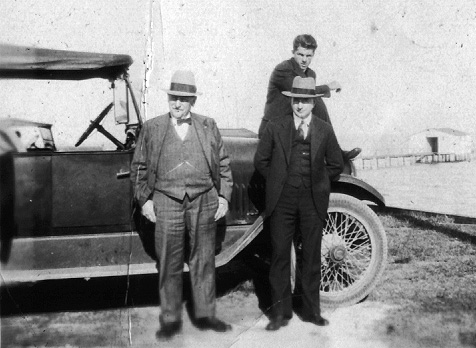 Wm Altreuter standing in front of a car.